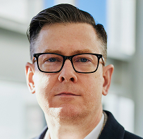 Alexander Hughes CEO Porträt Führungskraft Krypto-Trading-Unternehmen